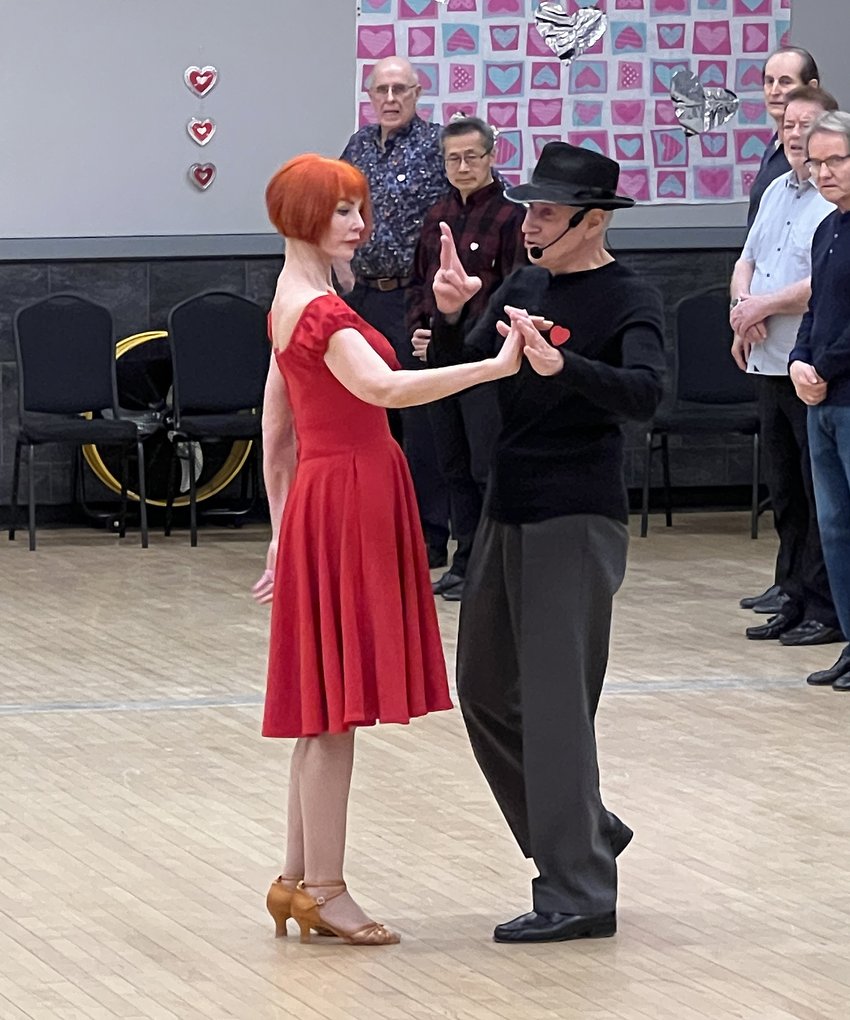 Tibor and Megan of Dance First teaching a dance class, demonstrating a step to students